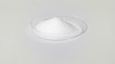 High-Angle Shot of White Powder in Petri Dish on Gray