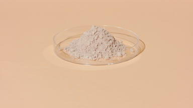 Beige Powder in Lab Dish with Dynamic Shadow Movement