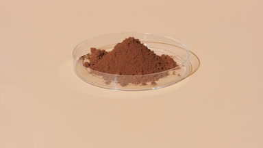 Lab Petri Dish with Brown Powder and Fluid Lighting
