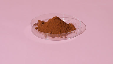 Red Iron Oxide Powder in Petri Dish with Light Effects