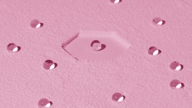 High-Angle Shot of Pale Pink Powder with Hydrogel Spheres