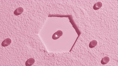 Light Pink Powder Surface with Hydrogel Spheres and Shadows