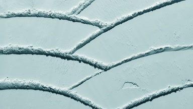 Moving Shadows on Pale Cyan Powder Surface