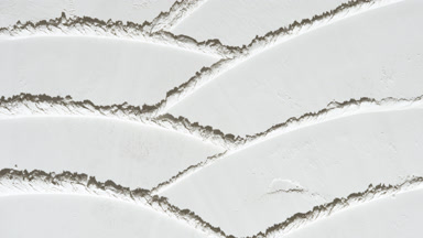Fluid Shadows on White Powder Surface