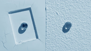 Pale Blue Powder Surface with Hydrogel Spheres and Fluid Shadow