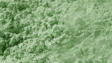 Pale Green Powder Scattered by Air in Macro Slow Motion