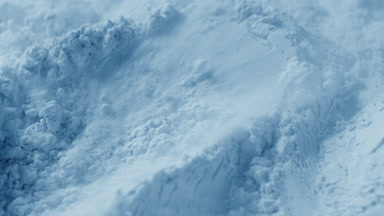 Pale Blue Powder Surface Disturbed by Air in Slow Motion