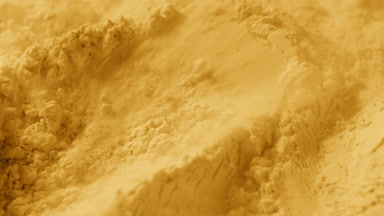 Yellow Powder Surface Disturbed by Air in Slow Motion