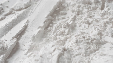 Extreme Close-Up of Chaotic White Powder in Motion