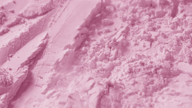 Close-Up of Chaotic Pink Powder Surface in Slow Motion