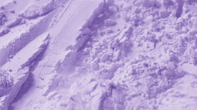Macro Shot of Disturbed Violet Powder Surface in Motion