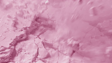 Intense Macro of Fractured Pink Powder Surface in Motion