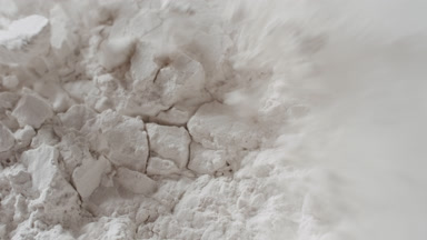 Detailed Macro of Snapped White Powder Surface in Slow Motion