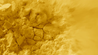 Detailed Macro Capture of Cracked Yellow Powder Surface