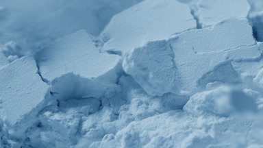 Macro View of Fragmented Pale Blue Powder Surface