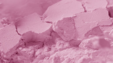 Intense Macro Capture of Cracked Pink Powder Surface