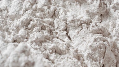 Macro Close-Up of Textured White Powder Surface