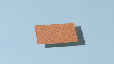 Morphing Shadow of Brown Powder on Pale Blue
