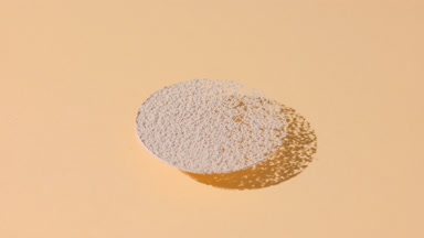 Orbiting Shot of Beige Powder for Foundation Promotion