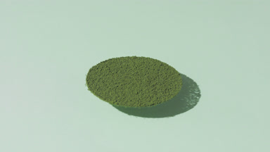 Circular Green Powder Casting Shadows on Pale Green