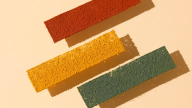Arc Shot of Colorful Powder Stripes on Transparent Surface