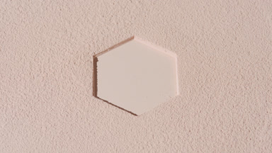 Orbiting Shot of Beige Sifted Powder with Hexagonal Imprint