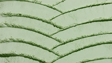 Dynamic Knife Trails on Pale Green Powder Surface