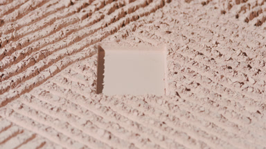 Changing Shadows on Beige Powder with Rectangular Imprint