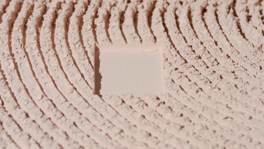 Orbiting Shot of Beige Powder with Rectangular Engraving