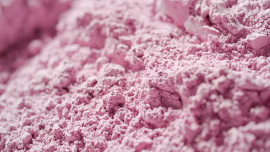 Macro Slow-Motion of Cascading Pastel Pink Powder