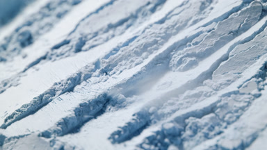 Pale Blue Powder Layer Lifted by Air Stream in Macro