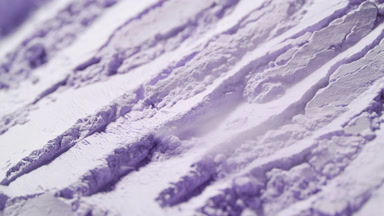 Extreme Close-Up of Air Stream Exposing Violet Powder Ridges
