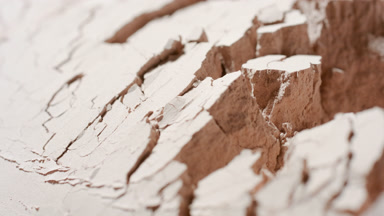 Ultra-Close Slow Motion of Disturbed Beige Powder Surface