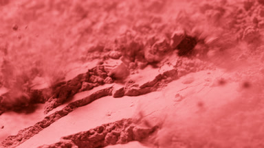 Macro Slow Motion of Red Powder Layer with Surface Ridges