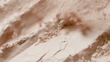 High-Magnification Slow-Motion Beige Powder Reveal