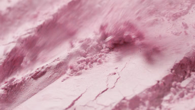 Slow-Motion Close-Up of Pink Powder Surface