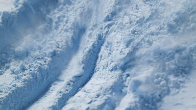 Air Stream Reveals Blue Powder Texture in Slow Motion