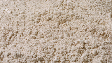 Beige Powder Surface in Vertical Orbit Shot
