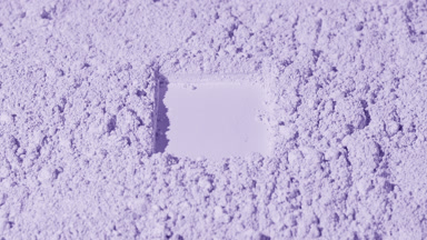Violet Powder Surface with Rectangular Impression and Shadows
