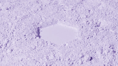 Dynamic Violet Powder Surface with Hexagonal Imprint
