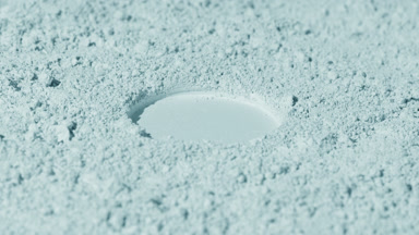 Vertical Arc of Pale Cyan Powder Surface with Round Imprint