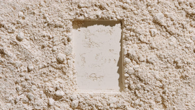Beige Powder Surface with Rectangular Indentation and Shadows