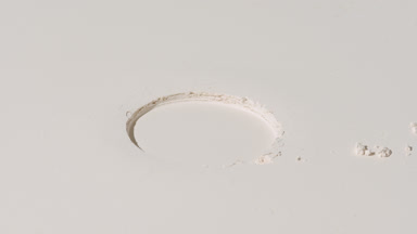 Shifting Shadows on Beige Flat Powder Layer