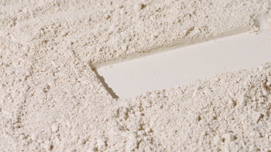 Dynamic Beige Powder Surface with Rectangle Imprint