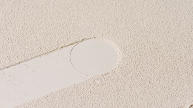 Dynamic Beige Powder Surface with Moving Shadows