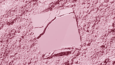 Cracked Powder on Pale Pink Surface with Dynamic Shadows