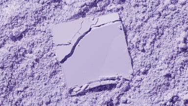 Cracked Powder on Violet Surface with Orbiting Light