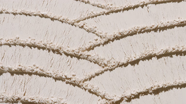 Beige Powder Surface with Knife Trails and Fluid Shadows