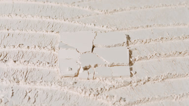 Cracked Square Pressed Powder on Beige with Knife Marks
