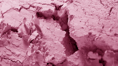 Extreme Close-Up of Disturbed Baby Pink Powder Surface